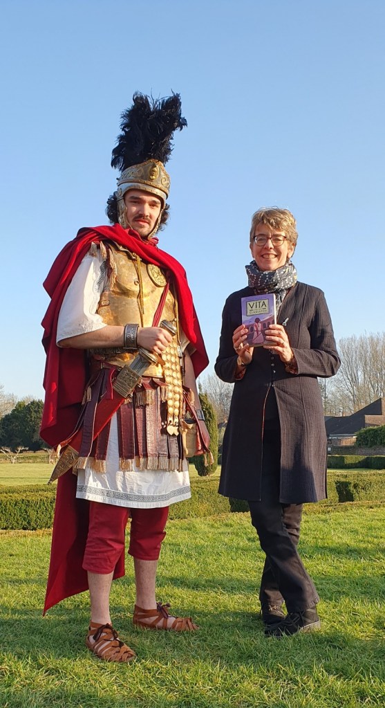 Ally Sherrick with a member of the team at Fishbourne Roman Palace dressed as a Roman soldier