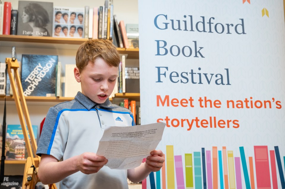 Ben, prizewinner of the Guildford Book Festival gladiator writing competition reading his story